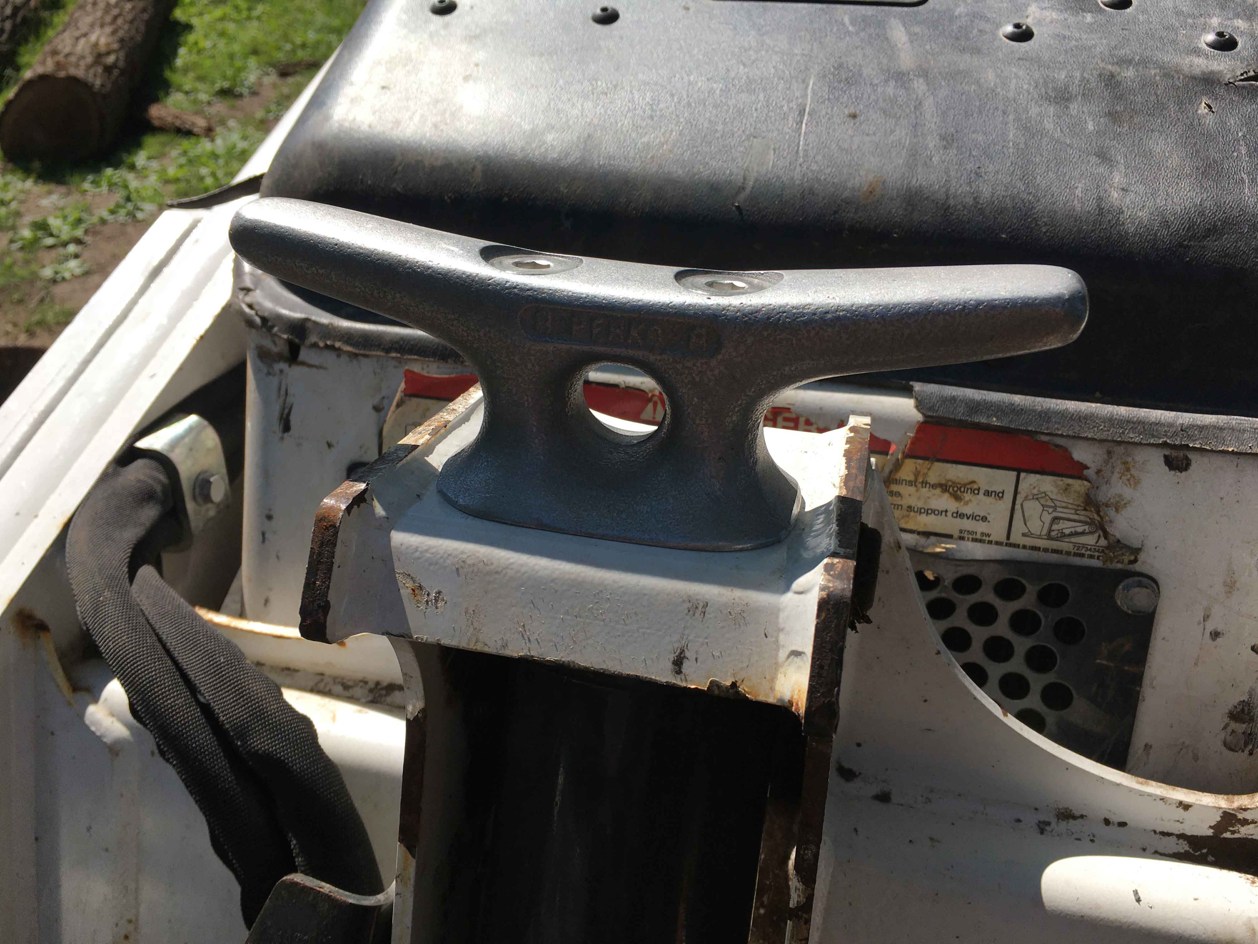 marine cleat installed on Bobcat loader arm